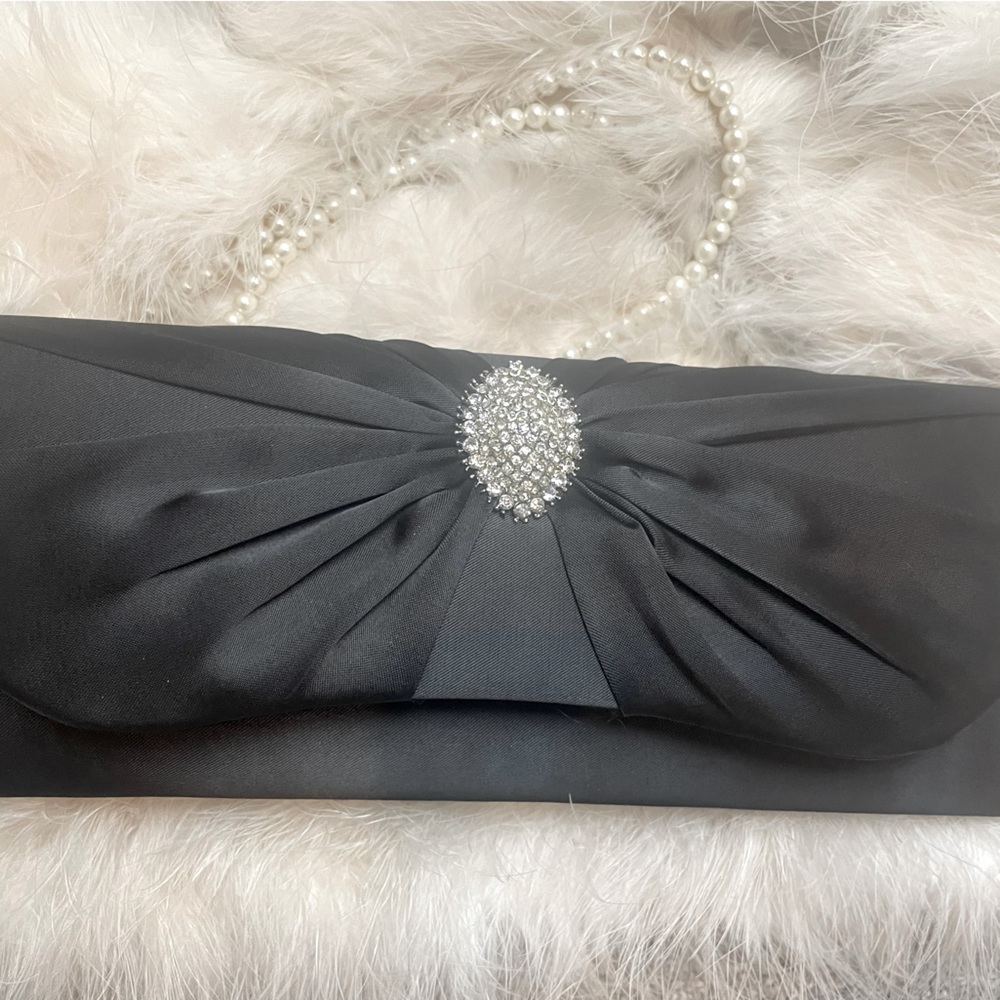 Clutch with sparkly brooch